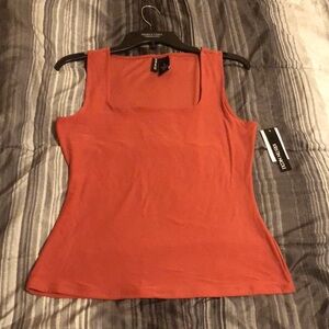 Kristin Nicole, Size small, a burnt orange color.
Sleeveless top
